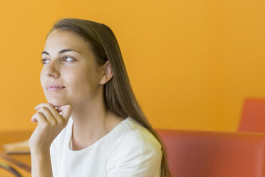 Pensive businesswoman with hand on chin - CAIF19673