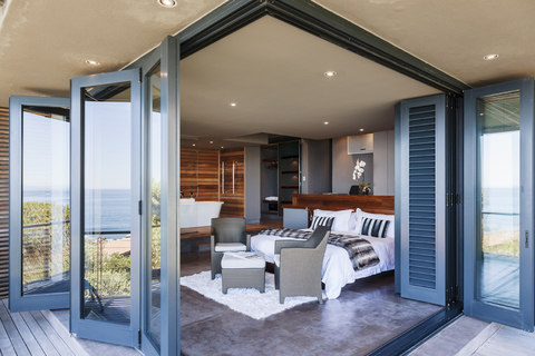 Doors on patio open to modern bedroom stock photo