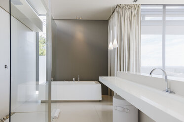 Sink and bathtub in modern bathroom - CAIF19926