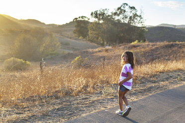 Portrait of girl standing on road - CAVF11002