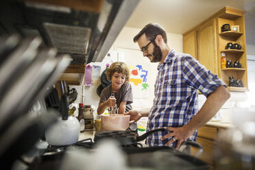 Father and daughter baking food at home - CAVF11045