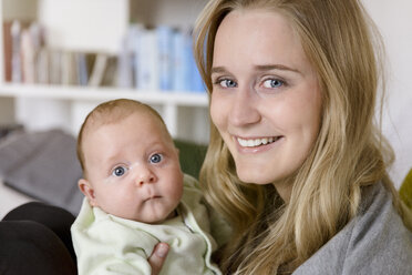 Smiling mother with her baby boy - BMOF00046