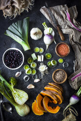 High angle view of various food with spoons and knife by napkin on slate - CAVF12147