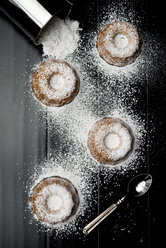 Overhead view of bundt cake with sugar on table - CAVF12201