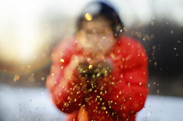 Blurred image of boy playing with snow - CAVF12589