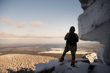 Rear view of hiker standing on mountain - CAVF13005