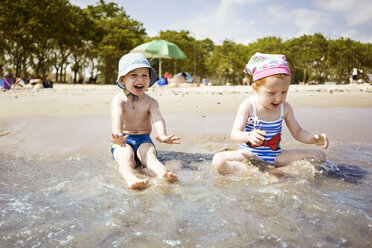 Children playing in water at beach - CAVF14199