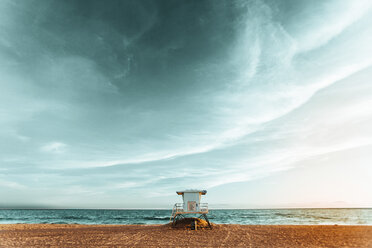 Lifeguard hut on beach against cloudy sky - CAVF14361