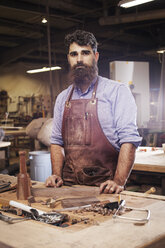 Portrait of confident Craftsman standing at wood shop - CAVF14399