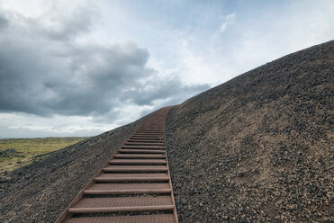 Metallic steps on mountain against cloudy sky - CAVF15165