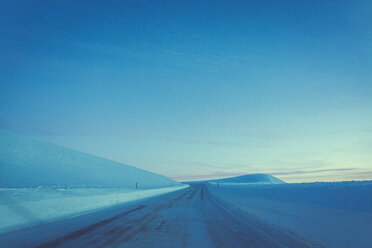 View of snow covered field against blue sky - CAVF15265