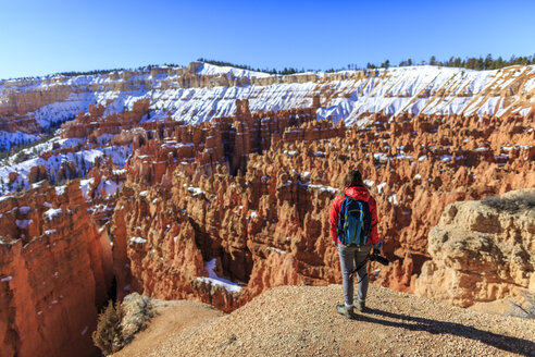 Rear view of hiker standing on mountain against clear sky at Bryce Canyon National Park - CAVF15332