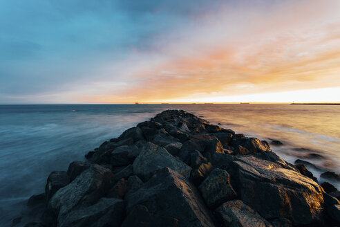Rocks on sea against sky during sunset - CAVF15435