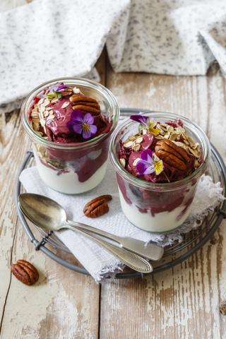 Nicecream, made of banana and blueberry, yogurt and granola stock photo