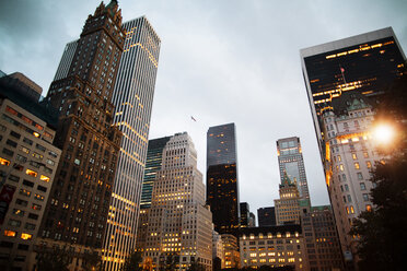 Low angle view of illuminated modern buildings against sky - CAVF16114