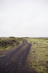 Dirt road on field against sky - CAVF16268