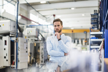 Young businessman in factory - DIGF03473