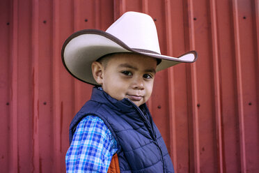 Portrait of confident boy wearing cowboy hat - CAVF16852