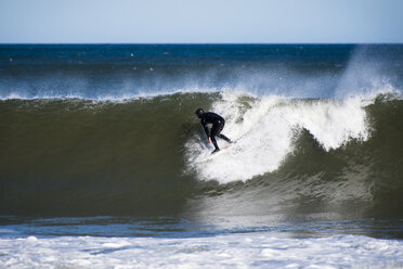 Full length of man surfing in sea - CAVF17034