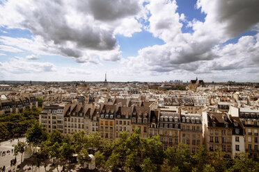 Aerial view of cityscape with Eiffel tower against cloudy sky - CAVF17552