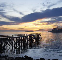 Pier over sea against sky during sunset - CAVF17987