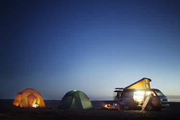 Camping equipment at beach against clear blue sky - CAVF18074