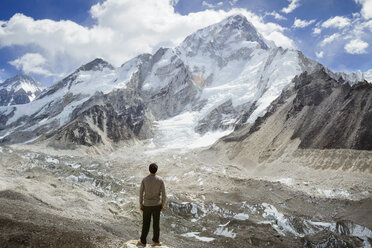 Rear view of man looking at Mt. Everest during winter - CAVF18173