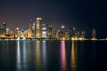 Illuminated cityscape by Lake Michigan - CAVF18438