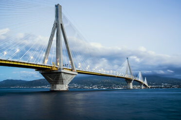 Rio-Antirion Bridge over sea against cloudy sky - CAVF18630