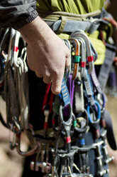 Midsection of man with carabiner - CAVF19255