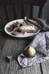 High angle view of fig with bread slices on wooden table - CAVF19570