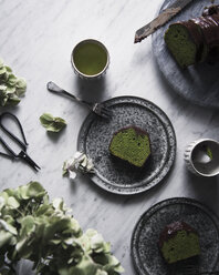 Overhead view of matcha pound cake with chocolate on table - CAVF19642