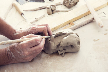 Cropped image of woman working in workshop - CAVF20106