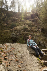 Female hiker relaxing on rock - CAVF20324