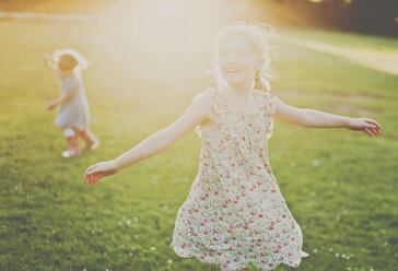 Cheerful girls playing on field - CAVF20470