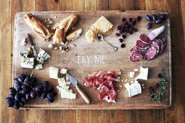 Overhead view of ingredients on wooden cutting board - CAVF20595