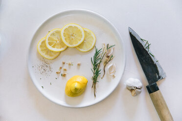 Overhead view of lemon slices in plate on table - CAVF20677