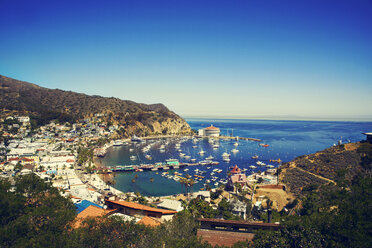 High angle view of harbor by town against clear blue sky - CAVF22053