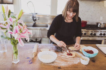 Woman making food at home - CAVF22598