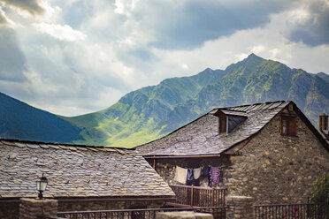 Houses and mountains against cloudy sky - CAVF22748