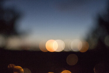Defocused image of illuminated lights at dusk - CAVF23065