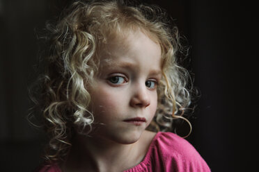 Close-up portrait of girl against black background - CAVF23150