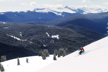 Man skiing on snow against mountain range - CAVF23849