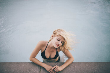 High angle view of sensuous woman in swimming pool - CAVF23951