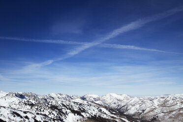 Scenic view of snow covered Wasatch Mountain range against sky - CAVF24095