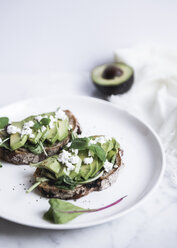 Close-up of avocados on breads served in plate - CAVF24242