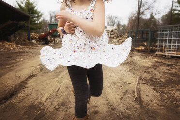 Midsection of girl running on dirt road - CAVF24622