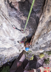 Thailand, Krabi, Tonsai beach, woman climbing in rock wall - ALRF01030