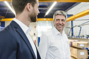 Businessmen during meeting in production hall - DIGF03535