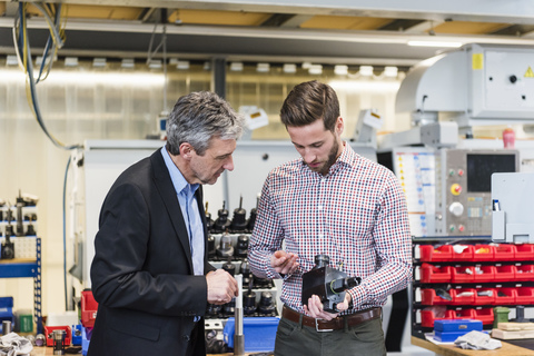 Businessmen during meeting with product stock photo